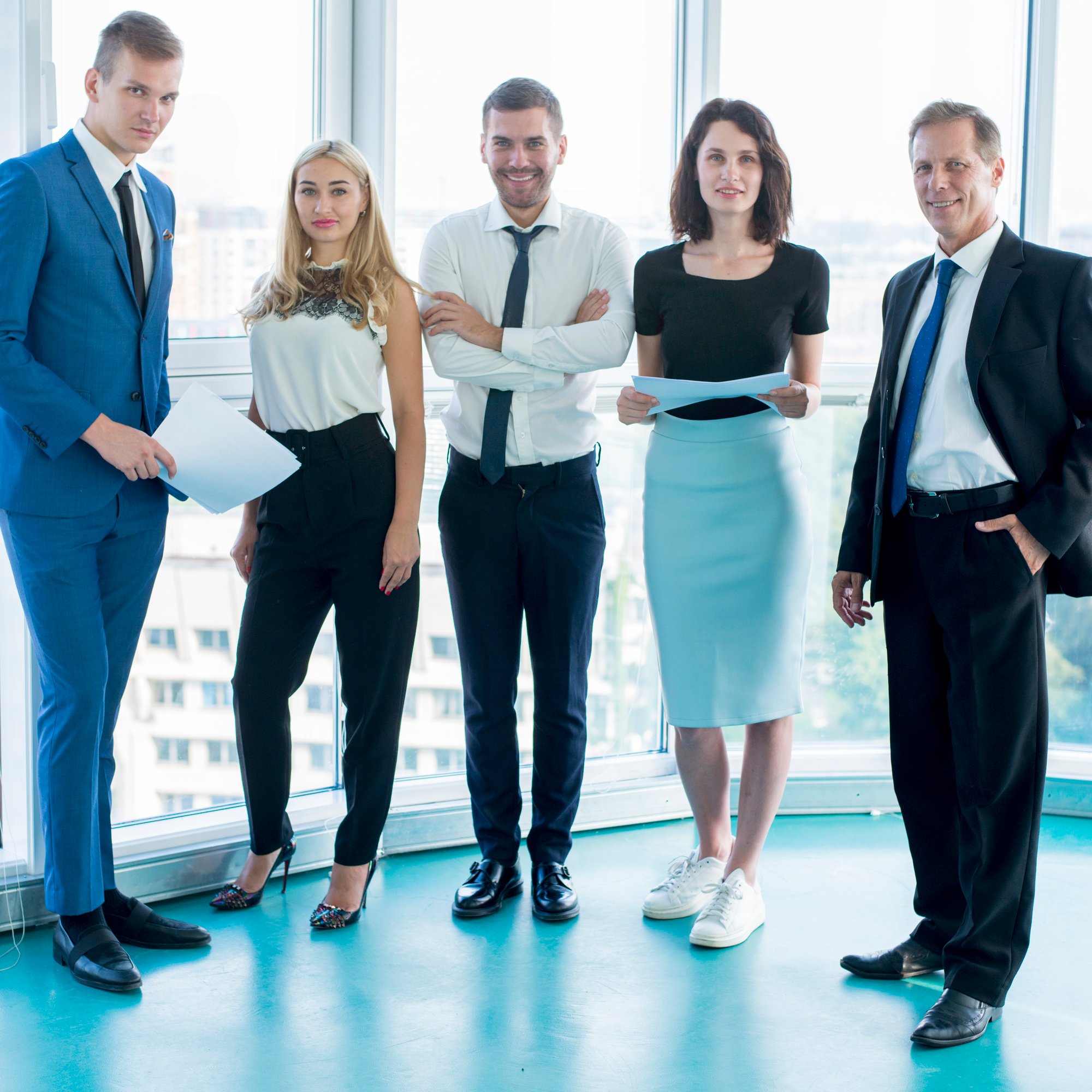 group-confident-businesspeople-standing-office